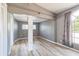 Open bedroom provides bright space with hardwood floors and neutral wall color with good lighting at 1234 Parker Ave, Deltona, FL 32725