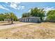 Exterior side view shows a single-story home with a well-maintained lawn and driveway at 1234 Parker Ave, Deltona, FL 32725