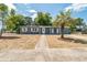 Charming single story home features a well-manicured lawn and a welcoming entrance at 1234 Parker Ave, Deltona, FL 32725