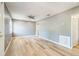 Open-concept living room with hardwood flooring, ample natural light, and neutral color scheme at 1234 Parker Ave, Deltona, FL 32725