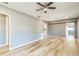 Modern living room boasts hardwood flooring, ample space, and well-lit ambiance at 1234 Parker Ave, Deltona, FL 32725