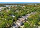 An aerial view of the home's location in a neighborhood with mature trees and a lake in the distance at 1341 Lyndale Blvd, Winter Park, FL 32789