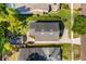 Aerial view of the home's roof, driveway, and surrounding landscaped yard and neighboring houses at 1341 Lyndale Blvd, Winter Park, FL 32789