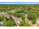Aerial view of the home and neighborhood, displaying mature trees and proximity to a lake at 1341 Lyndale Blvd, Winter Park, FL 32789