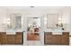 Double-vanity bathroom with framed mirrors that leads to main bedroom at 1341 Lyndale Blvd, Winter Park, FL 32789