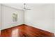 Cozy bedroom featuring a ceiling fan, natural lighting, and hardwood floors at 1341 Lyndale Blvd, Winter Park, FL 32789