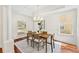 Dining room with a decorative chandelier, hardwood floors, and natural light at 1341 Lyndale Blvd, Winter Park, FL 32789