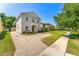 Beautiful home featuring a brick driveway, lush lawn, and meticulous landscaping at 1341 Lyndale Blvd, Winter Park, FL 32789