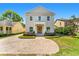 Charming two-story home with landscaped front yard and inviting brick paver driveway at 1341 Lyndale Blvd, Winter Park, FL 32789