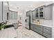 Spacious kitchen with gray cabinets, marble countertops, stainless steel appliances, and tile flooring at 1341 Lyndale Blvd, Winter Park, FL 32789