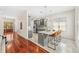 Charming kitchen with gray cabinets, marble countertops, stainless steel appliances, and island with barstool seating at 1341 Lyndale Blvd, Winter Park, FL 32789