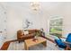 Cozy living room with natural light, a stylish coffee table, and comfortable seating at 1341 Lyndale Blvd, Winter Park, FL 32789