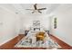Spacious main bedroom features a ceiling fan, tray ceiling, and hardwood floors at 1341 Lyndale Blvd, Winter Park, FL 32789