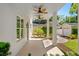 Covered patio with tiled floor, ceiling fans, and view of garden at 1341 Lyndale Blvd, Winter Park, FL 32789
