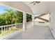 Covered porch with white columns overlooking green landscaping at 1341 Lyndale Blvd, Winter Park, FL 32789