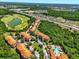 Aerial view of community featuring lush landscaping, swimming pool and golf course in the distance at 1375 Tuscana Ln # 1408, Davenport, FL 33896