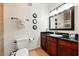 Well-lit bathroom with vanity, mirror, and tiled floors at 1375 Tuscana Ln # 1408, Davenport, FL 33896