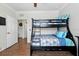 Bedroom featuring bunk beds with blue accents and wood-look floors at 1375 Tuscana Ln # 1408, Davenport, FL 33896