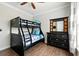 Bedroom featuring a black bunk bed and dresser with decorative mirror at 1375 Tuscana Ln # 1408, Davenport, FL 33896