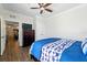 Spacious bedroom with hardwood floors, closet, and a comfortable king-size bed at 1375 Tuscana Ln # 1408, Davenport, FL 33896