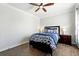 Comfortable bedroom with a stylish bed, side tables, and hardwood flooring at 1375 Tuscana Ln # 1408, Davenport, FL 33896