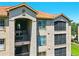 Exterior shot of condo building featuring multiple balconies and covered entrances at 1375 Tuscana Ln # 1408, Davenport, FL 33896