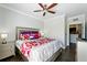 Comfortable main bedroom with hardwood floors, ceiling fan, and stylish decor at 1375 Tuscana Ln # 1408, Davenport, FL 33896