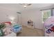bedroom featuring a play tent, twin bed, and ceiling fan at 14838 Bahama Swallow Blvd, Winter Garden, FL 34787
