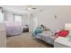 bedroom with a play tent and a neatly decorated twin bed at 14838 Bahama Swallow Blvd, Winter Garden, FL 34787