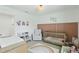 Stylish Bedroom with crib, changing table, neutral color scheme, and modern decor at 14838 Bahama Swallow Blvd, Winter Garden, FL 34787