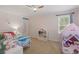 bedroom featuring a play tent, twin bed, and ceiling fan at 14838 Bahama Swallow Blvd, Winter Garden, FL 34787