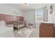 Cozy Bedroom with crib, chair, natural light, and views of the outdoors at 14838 Bahama Swallow Blvd, Winter Garden, FL 34787