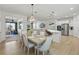 Open concept floor plan with a view of the modern dining room at 14838 Bahama Swallow Blvd, Winter Garden, FL 34787