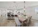 Open-concept kitchen and dining room featuring stylish pendant lighting at 14838 Bahama Swallow Blvd, Winter Garden, FL 34787