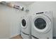 Practical laundry room with stacked washer and dryer, maximizing space efficiency at 14838 Bahama Swallow Blvd, Winter Garden, FL 34787