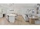 Spacious living area with kitchen island and open access to the living room at 14838 Bahama Swallow Blvd, Winter Garden, FL 34787
