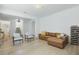 Comfortable living area featuring hardwood floors, stylish seating, and a cozy atmosphere at 14838 Bahama Swallow Blvd, Winter Garden, FL 34787
