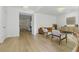 Bright and airy living room featuring modern hardwood floors and ample natural light at 14838 Bahama Swallow Blvd, Winter Garden, FL 34787