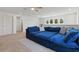 Upstairs loft featuring a cozy blue sofa and plenty of room for entertaining at 14838 Bahama Swallow Blvd, Winter Garden, FL 34787