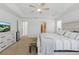 Calming main bedroom with large windows and en-suite bathroom access at 14838 Bahama Swallow Blvd, Winter Garden, FL 34787