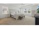 Spacious bedroom with natural light, carpet floors, and light-colored furniture at 14838 Bahama Swallow Blvd, Winter Garden, FL 34787