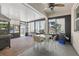 Enclosed patio featuring a built-in grill with large windows at 14838 Bahama Swallow Blvd, Winter Garden, FL 34787