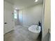 Elegant bathroom featuring a freestanding tub, a sleek glass-enclosed shower, and modern fixtures at 15750 Sw 40Th Ter Sw 40Th Ter, Ocala, FL 34473