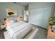 Cozy bedroom featuring a large bed, plush carpet, and closet space at 15750 Sw 40Th Ter Sw 40Th Ter, Ocala, FL 34473