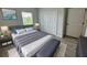 Comfortable bedroom featuring a large bed, plush bedding, and ample natural light with closet space at 15750 Sw 40Th Ter Sw 40Th Ter, Ocala, FL 34473