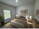 Comfortable bedroom featuring neutral decor, large window, and tasteful furnishings at 15750 Sw 40Th Ter Sw 40Th Ter, Ocala, FL 34473