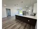 Stylish kitchen with a quartz countertop island, stainless steel appliances, and modern pendant lighting at 15750 Sw 40Th Ter Sw 40Th Ter, Ocala, FL 34473