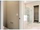 Bathroom featuring a glass shower, marble tile, and updated fixtures at 16271 Silver Grove Blvd, Winter Garden, FL 34787