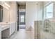 Ensuite bathroom with dual sinks, shower, and soaking tub, and walk-in closet at 16271 Silver Grove Blvd, Winter Garden, FL 34787