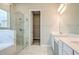 Bathroom featuring marble tile, double sinks and a glass shower at 16271 Silver Grove Blvd, Winter Garden, FL 34787